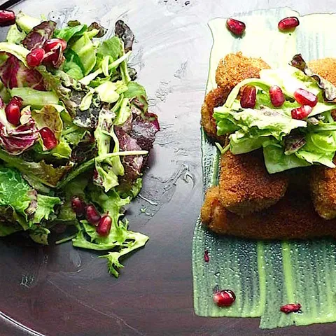 Croquettes with leaf salad and pomegranate