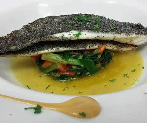 Fish fillet on wild greens