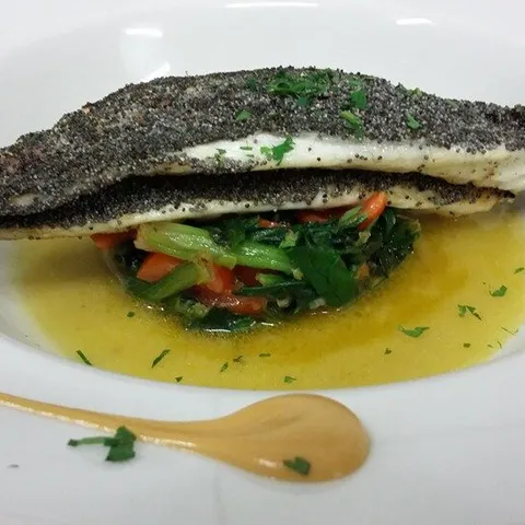 Fish fillet on wild greens