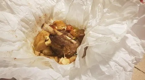 Lamb baked in paper