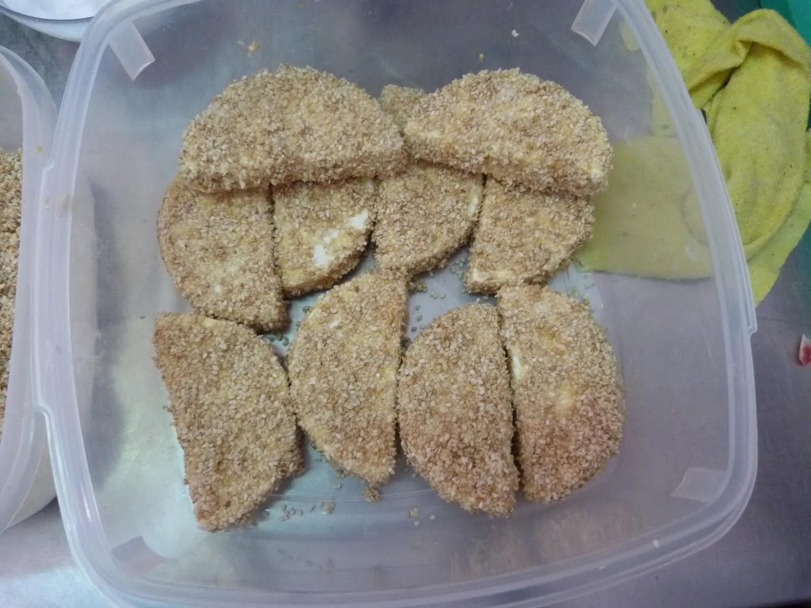 Pieces of manouri coated in sesame