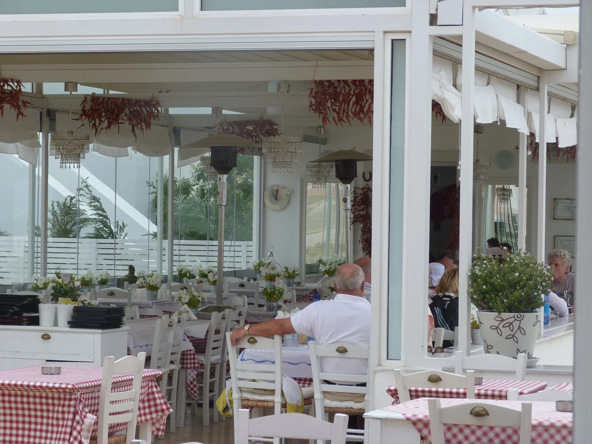 Guests at lunch on the Ouzeri terrace